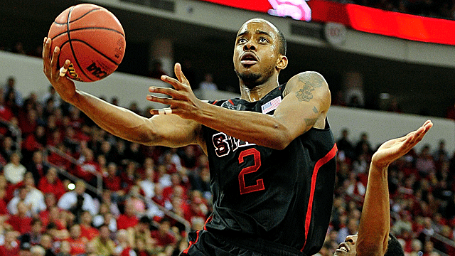 The Wolfpacks' Lorenzo Brown sprains his left ankle during last week's loss at Virginia. (Getty Images)