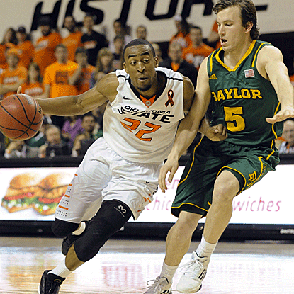 Markel Brown hits a layup with under a second left on the clock to win it for the Cowboys.  (AP)