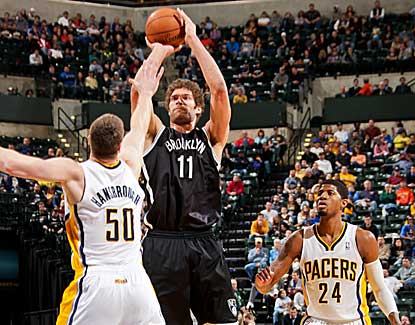 Brook Lopez shoots over Tyler Hansbrough during his 25-point performance against the Pacers. (Getty Images)