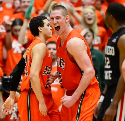Colorado State's Dorian Green (left) and Colton Iverson react to Green's three-point play with 19 seconds remaining.  (US Presswire)
