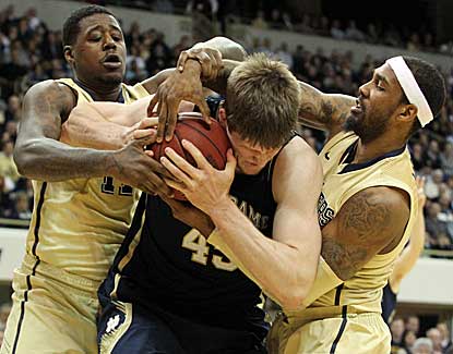 Notre Dame's Jack Cooley, center, scores 13 points with 9 rebounds to lead the Irish past Pitt. (US Presswire)