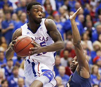 Elijah Johnson contributes 12 points and 10 assists along with five boards in the blowout. (AP)