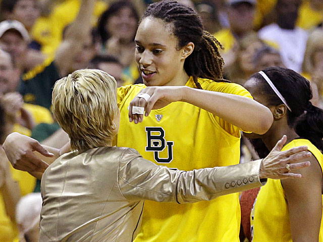 Baylor's Brittney Griner (right) hugs her coach, Kim Mulkey, as she leaves the game. (AP)
