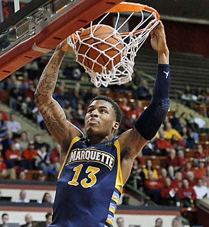Marquette's Vander Blue scores 22 points and later hits the game-clinching free throws. (AP)