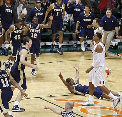 Marcus Georges-Hunt (floor) and the visiting Yellow Jackets prevent the Canes from clinching the outright ACC title. (USATSI) 