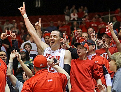 Jason Washburn celebrates with Utes fans after scoring 20 points and grabbing 13 rebounds in Utah's win over Oregon. (AP)