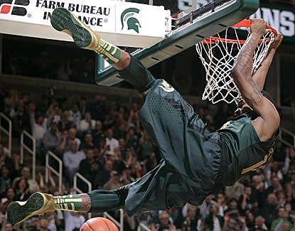 Keith Appling dunks for two of his team-high 16 points in Michigan State's win over Northwestern. (AP)