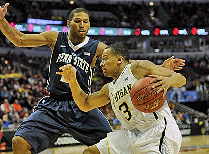 Michigan's Trey Burke (right) tries to get by Penn State's D.J. Newbill as he scores 21 points in the win.  (USATSI)