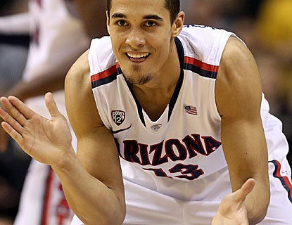 Nick Johnson scores 18 points, including a contested shot with 34 seconds left to lift Arizona. (Getty Images)