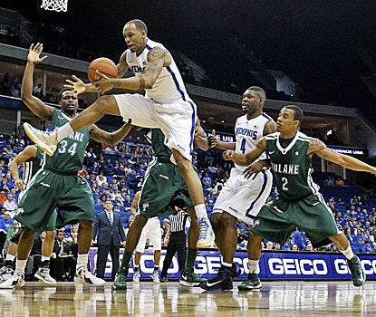 Memphis' Ferrakohn Hall (right) grabs a rebound in front of Tulane's Tre Drye as the Tigers cruise to a 81-68 win. (AP)