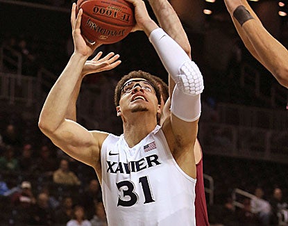 Xavier's Isaiah Philmore misses the easy layup, the ball bouncing off the rim as he fell to the court in dismay. (Getty Images)