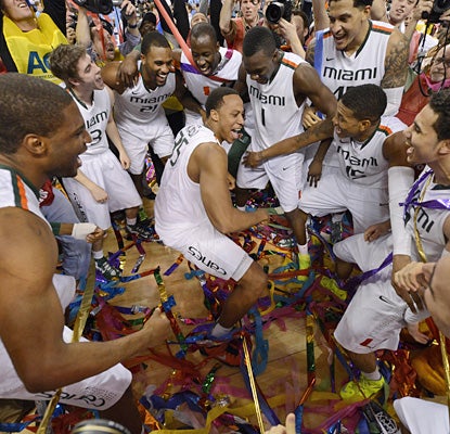 Kenny Kadji is the center of attention as Miami celebrates its first ACC tournament championship.  (USATSI)