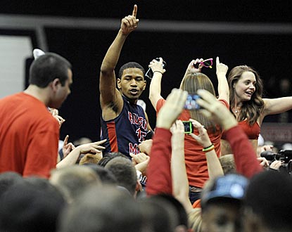 Karvel Anderson gets a hero's sendoff from Robert Morris revelers after the Colonials topple Kentucky.  (AP)