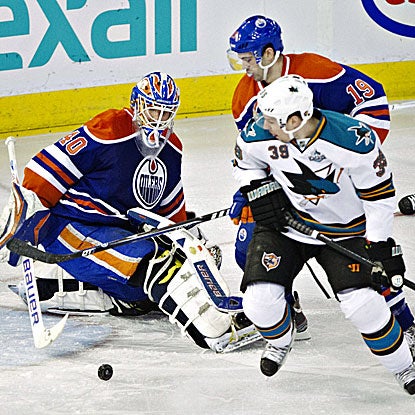Logan Couture (right) scores twice in regulation and adds a shootout goal againstg the Oilers. (AP)