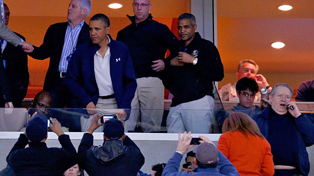 President Obama gets a lot of attention as he makes his way to his suite seat. (Getty Images)