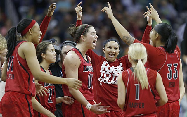Sara Hammond (00) exults as her teammates celebrate Louisville's berth in the NCAA title game. (USATSI)