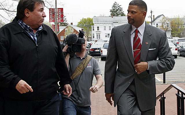 A Rutgers fan greets Jordan as the new coach arrives to take over the program. (AP)