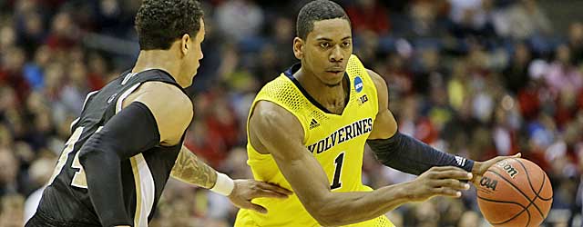 Glenn Robinson III and Michigan drive strong into the regional semis. (Getty Images)