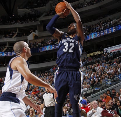 The Grizzlies' O.J. Mayo rises over the Mavericks' Jason Kidd to score two of his 20 points.   (Getty Images)