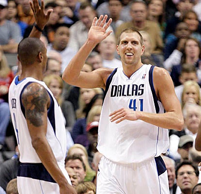 With freshly shorn locks, Dirk Nowitzki comes up with 25 points in Monday's win. (AP)