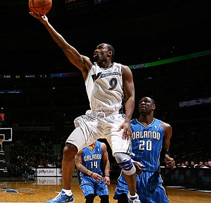 Washington's best scorer Saturday, Gilbert Arenas, drives past a Magic defender. (Getty Images)