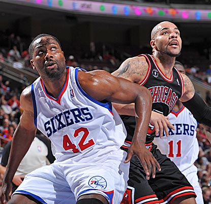 Elton Brand boxes out the Bulls' Carlos Boozer on a night when the Sixers shoot 78 percent in the third quarter. (Getty Images)