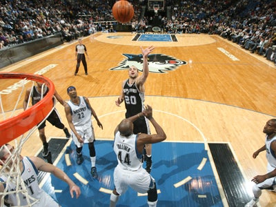 Manu Ginobili (20) leads the Spurs to their 16th straight win over a struggling Timberwolves team.  (Getty Images)