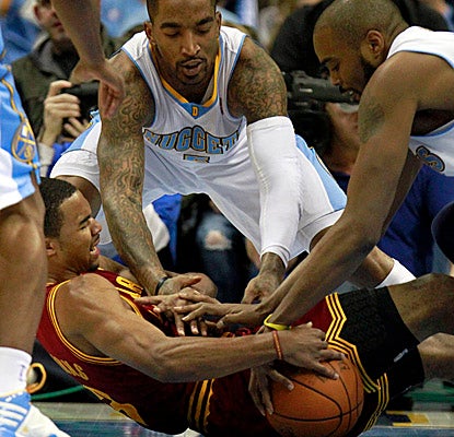 The Nuggets are all over Ramon Sessions and the Cavs on Saturday at the Pepsi Center. (AP)