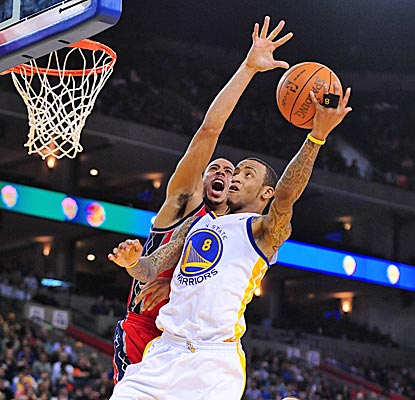 Monta Ellis drives for two of his 26 points, and the Warriors win their sixth straight over the Nets. (US Presswire)