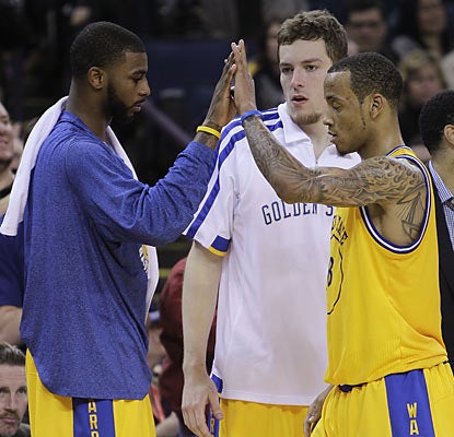 Dorell Wright, David Lee and Monta Ellis combine for 53 of the Warriors' 102 points in the comeback against the Hornets.  (AP)