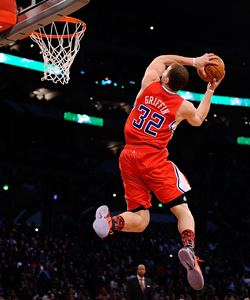 Blake Griffin slams home a difficult reverse 360 in the first round. (Getty Images)