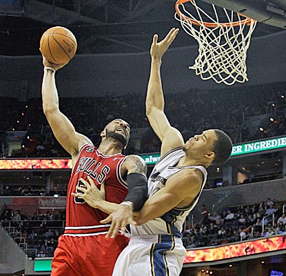 Carlos Boozer pushes aside JaVale McGee for two of his 12 points and the Bulls push around the Wizards in a 28-point win. (Getty Images)