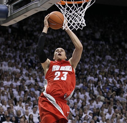 New Mexico guard Phillip McDonald goes up for a basket as he leads the Lobos to an upset over BYU with 26 points. (AP)