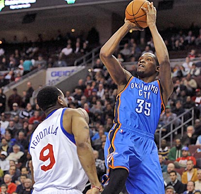 Kevin Durant shoots over 76ers guard Andre Iguodala, netting 34 and pulling down 16 boards in the overtime win. (US Presswire)