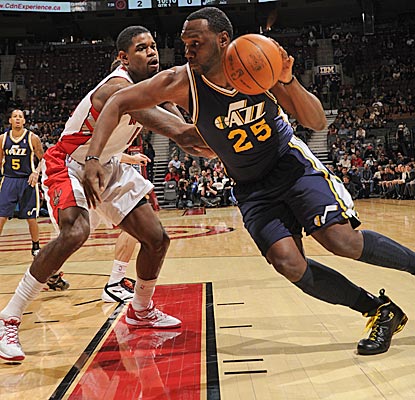 Al Jefferson drives against Amir Johnson, finishing with 34 points and the game-winning layup to rally the Jazz from 14 down. (Getty Images)