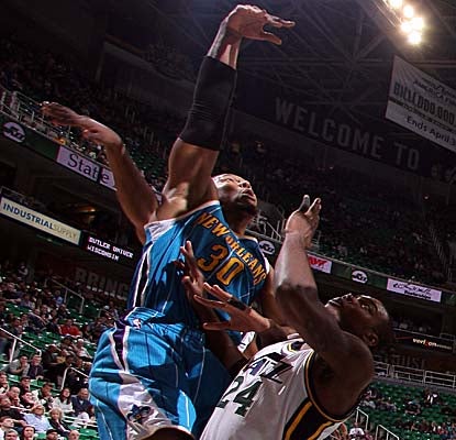 David West shoots over Jazz forward Paul Millsap, wrapping up with a team-high 29 points. (Getty Images)