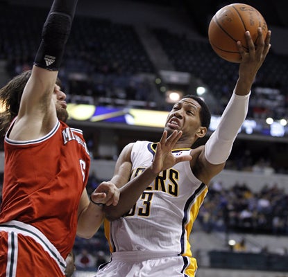 Danny Granger works around the Bucks defense and leads the Pacers with 17 points in an important win for No. 8 seed Indiana. (AP)