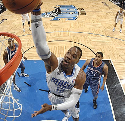 Dwight Howard throws down a dunk against the Bobcats, finishing with 26 points and 14 rebounds. (Getty Images)