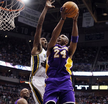 Kobe Bryant goes to the basket and scores 21 points in the Lakers' win over the Jazz, which eliminated Utah from the playoffs. (AP)