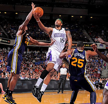 DeMarcus Cousins gets off a shot in the paint in the Kings' win over Utah. (Getty Images)