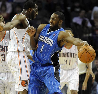 Gilbert Arenas runs into a defensive wall here, but leads the Magic with 25 points in an OT win.  (US Presswire)