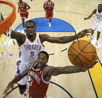 Brandon Jennings goes up for two of his team-high 16 points as eight Bucks net double figures.  (AP)