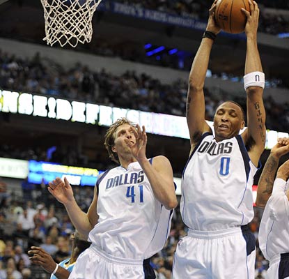 Dirk Nowitzki and Shawn Marion go for a rebound as the Mavs finish the season with a beatdown of New Orleans.  (US Presswire)