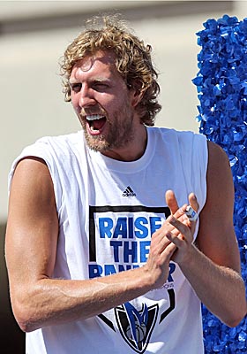 Dirk Nowitzki cheers during the Mavericks victory parade through Dallas. (Getty Images)