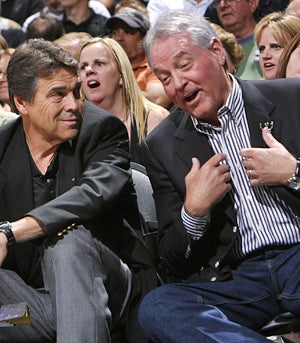 Labor hardliner Peter Holt (right, with Texas Gov. Rick Perry) got $145 million in public help to build a home for his Spurs. (Getty Images)