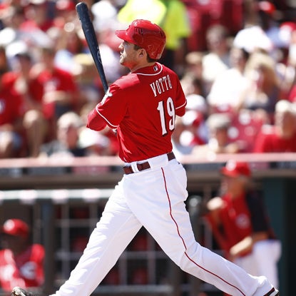 With a full count in the bottom of the 14th, Joey Votto sends his second HR of the game into the left-field bleachers.  (Getty Images)
