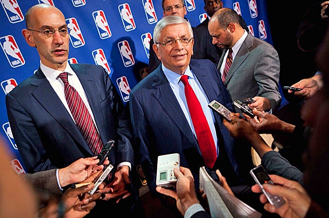 David Stern (center) and Adam Silver haven't spoken publicly since the players filed antitrust lawsuits. (AP)
