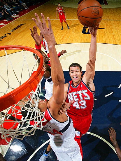 Kris Humphries tunes out the boos to score 21 points and grab 16 rebounds. (Getty Images)