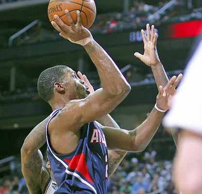 Joe Johnson (11 points) is one of six Hawks to reach double figures in scoring. (US Presswire)