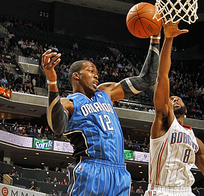 Dwight Howard dominates the paint with 20 points and 24 rebounds in a victory over the Bobcats. (Getty Images)